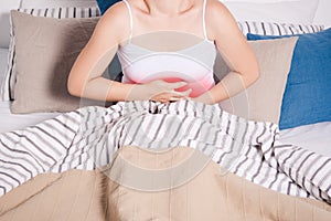 Stomach ache, woman with abdominal pain suffering at home