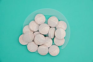 stomach tablets for digestion absorbable on blue background