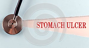 STOMACH ULCER word made on torn paper, medical concept background