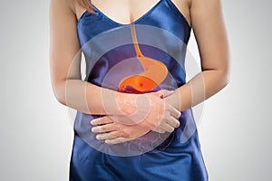 Stomach ulcers against gray background photo