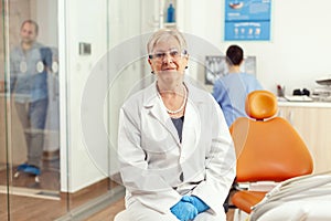 Stomatological doctor looking into camera while waiting for pacient examination