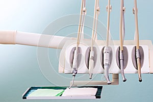 Stomatological instrument in the dentists clinic. Operation, tooth replacement.