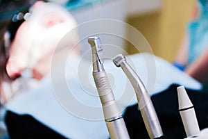Stomatological tool kit. Closeup hightech Dentist equipments. Dental treatment at the dentist, a client sitting in a dental chair