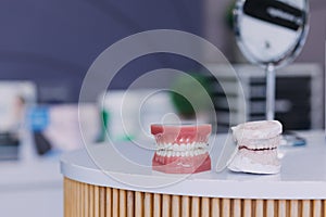 Stomatology concept, partial portrait of girl with strong white teeth looking at camera and smiling, fingers near face. Closeup of