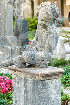 Stone Angel statue in ancient cemetery