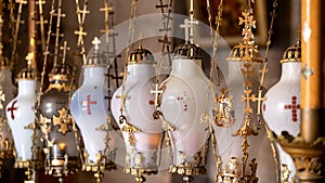 Stone of Anointing lamps in Holy Sepulchre Church in Jerusalem