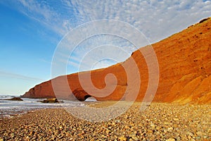 Stone arc on sea beach photo