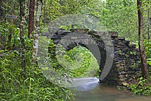 Stone arch bridge in the  Gudong Waterfall Tourist Area, China