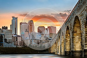 Stone Arch Bridge lights in Minneapolis at sunset