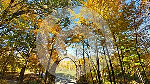 Stone Arch surrounded by Fall Trees
