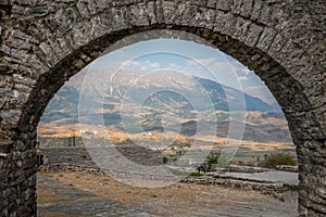 Stone Arch with a view of fortress ruins in Gjirokaster, Albania