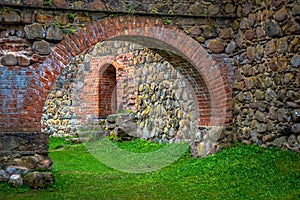 Stone arch and wall in internal courtyard