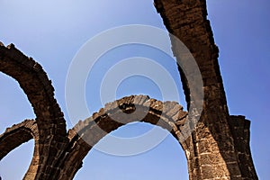 the stone arches in the ancient monument of Bara Kaman
