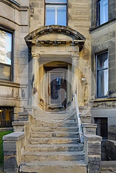 Stone architecture details, brownish door and strairs outdoors