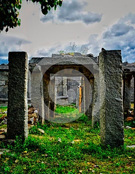 Stone architecture under open blue sky at Hampi