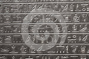 A stone artifact from ancient Egypt featuring hieroglyphics engraved in low relief