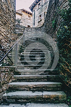 Stone ascendant stairs in a medieval village photo