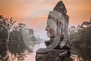 Stone Asura near South Gate of Angkor Thom in Siem Reap, Cambodia photo