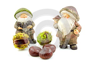 Stone autumn doll with chestnuts