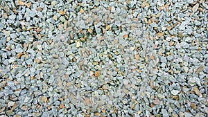 Stone background from crumbs of natural stone jasper, granite, gabbro, pebbles for landscape design, garden paths, rockeries, rock