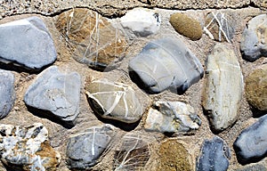 Stone background in gray, brown, orange and blue hues