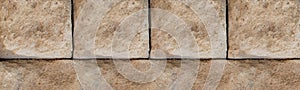 Stone background light beige is solid weathered folded a solid wall close-up