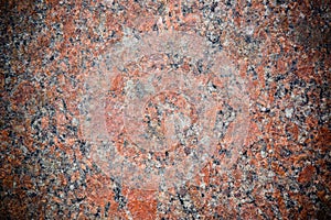 Stone Background of mottled red granite igneous rock