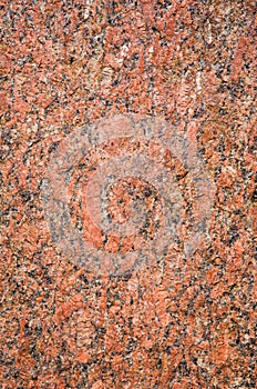 Stone Background of rough red granite igneous rock