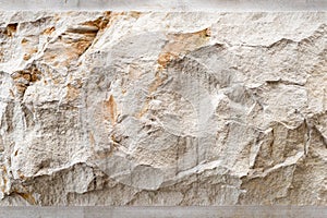 Stone background, sand wall pattern texture. Yellow natural stone facade, wall tile.