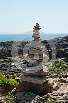 Stone balance  in border ocean