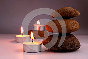 Stone balance and candle flame