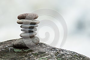 Stone balance on rock in border river