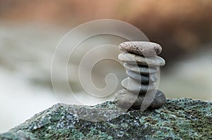Stone balance on rock in border river