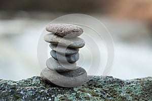 stone balance on rock in border river