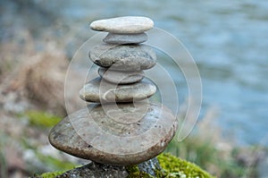 stone balance on rock in border river