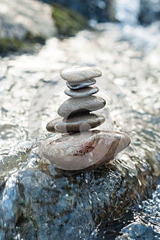 stone balance on rock in the river