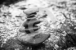 Stone balance on rock in the river