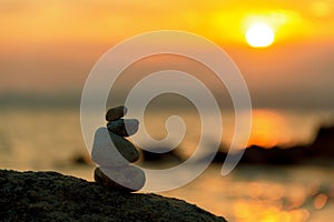 Stone balance in sunrise