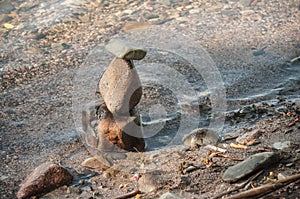 stone balance in the water in border lake