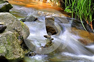 Stone balancing by the river