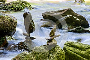 Stone balancing by the river