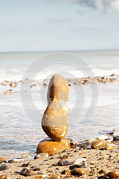 Stone balancing by the sea