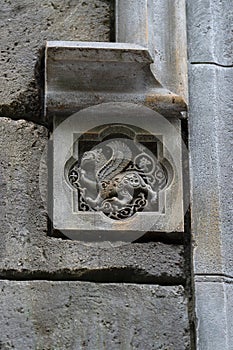 Stone bas-relief with a griffin built into the wall