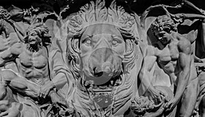 Stone bas-relief of lion and gods