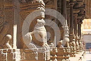 Stone bas-reliefs on the column in Shiva Virupaksha Temple, Hampi. Carving stone ancient background. Carved figures made of stone