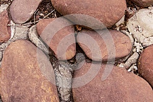 Stone beach brown pebble stone oval smooth close-up stone background