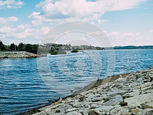 A stone beach by the lake