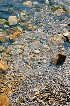 Stone beach, rocks under water.