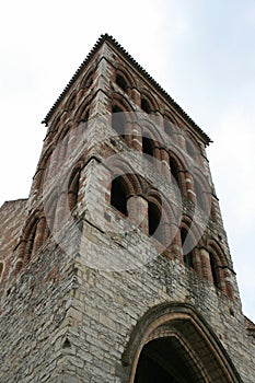 The stone bell tower of the Saint-BarthÃ©lÃ©my church in Cahors, France