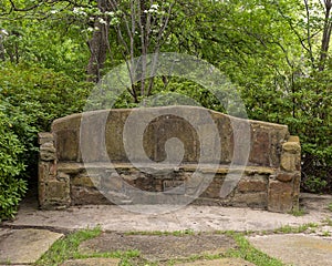 Stone bench constructed by the New Deal Works Progress Administration in the 1930`s in Turtle Creek Park, Dallas, Texas.